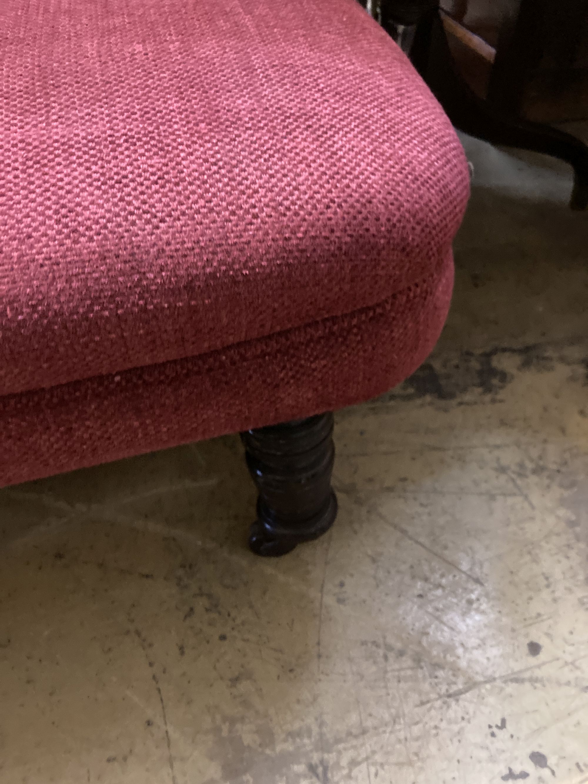 A late Victorian chaise longue, recently upholstered in red fabric, length 168cm, depth 70cm, height 74cm